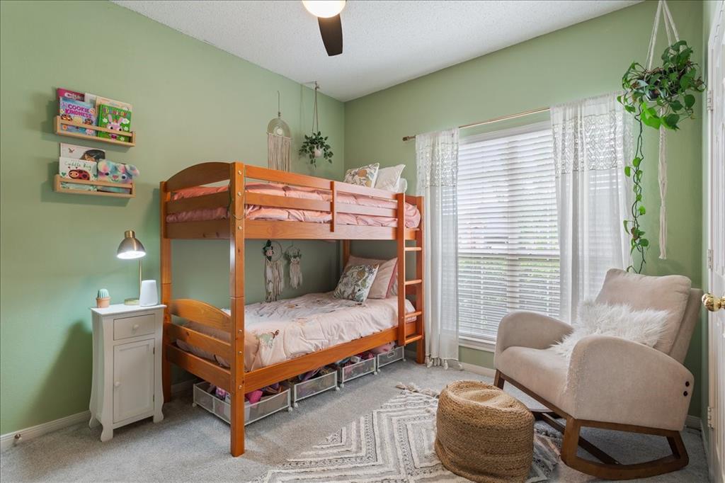 Interior room featuring light green walls and grey carpeting