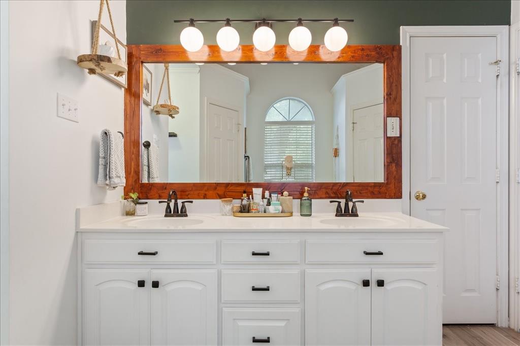 White dual vanity with quartz countertop, inset sinks, and matte black hardware