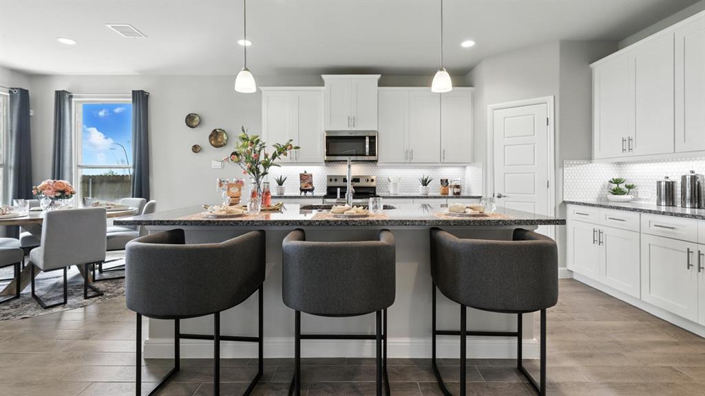 Kitchen - All Home and community information, including pricing, included features, terms, availability and amenities, are subject to change at any time without notice or obligation. All Drawings, pictures, photographs, video, square footages, floor plans, elevations, features, colors and sizes are approximate for illustration purposes only and will vary from the homes as built.