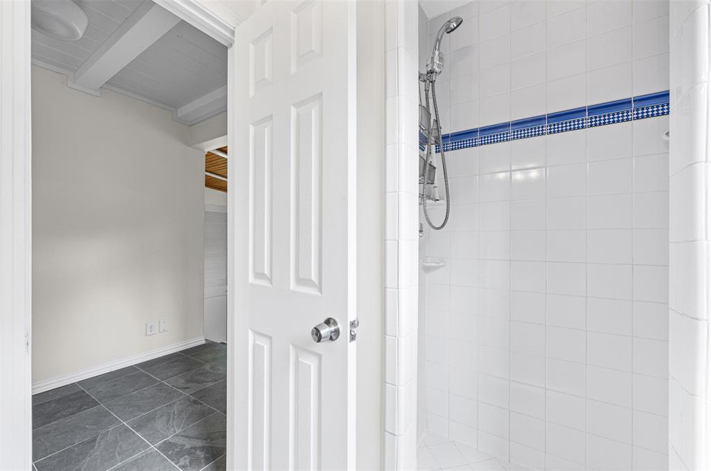 Full bathroom with tile shower