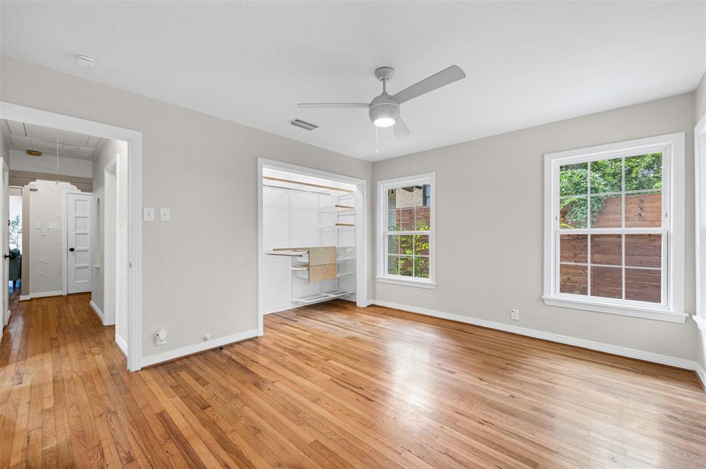 Bedroom with original hardwoods and closet built-ins