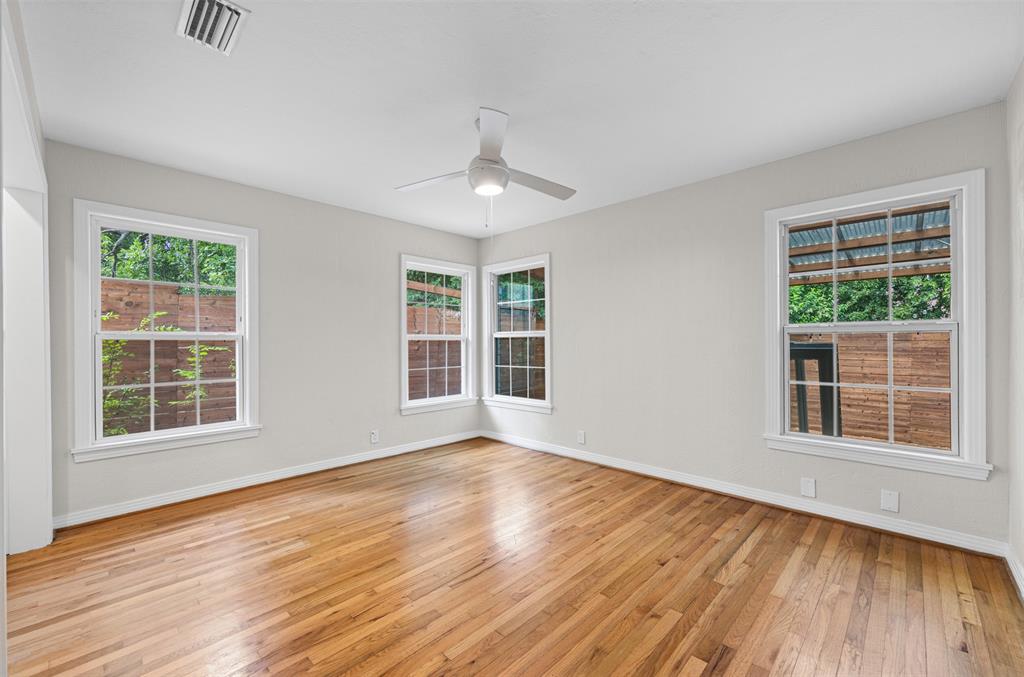 Bedroom with original hardwoods and ceiling fan