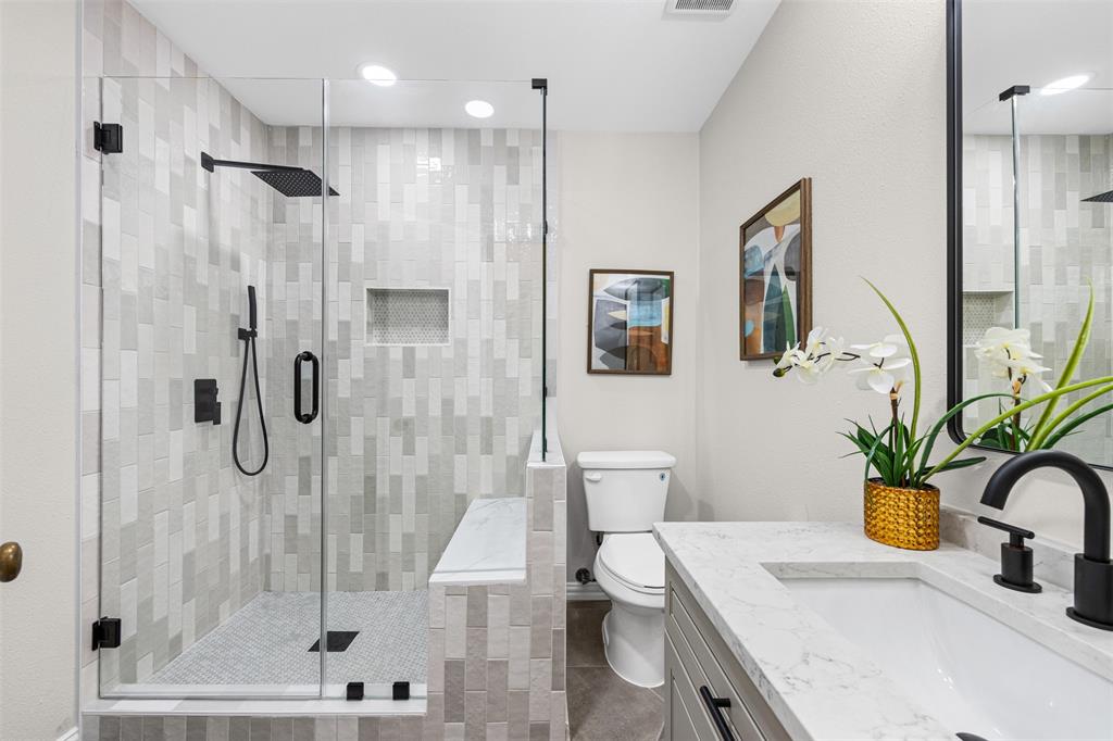 Fully updated bathroom with custom tile shower