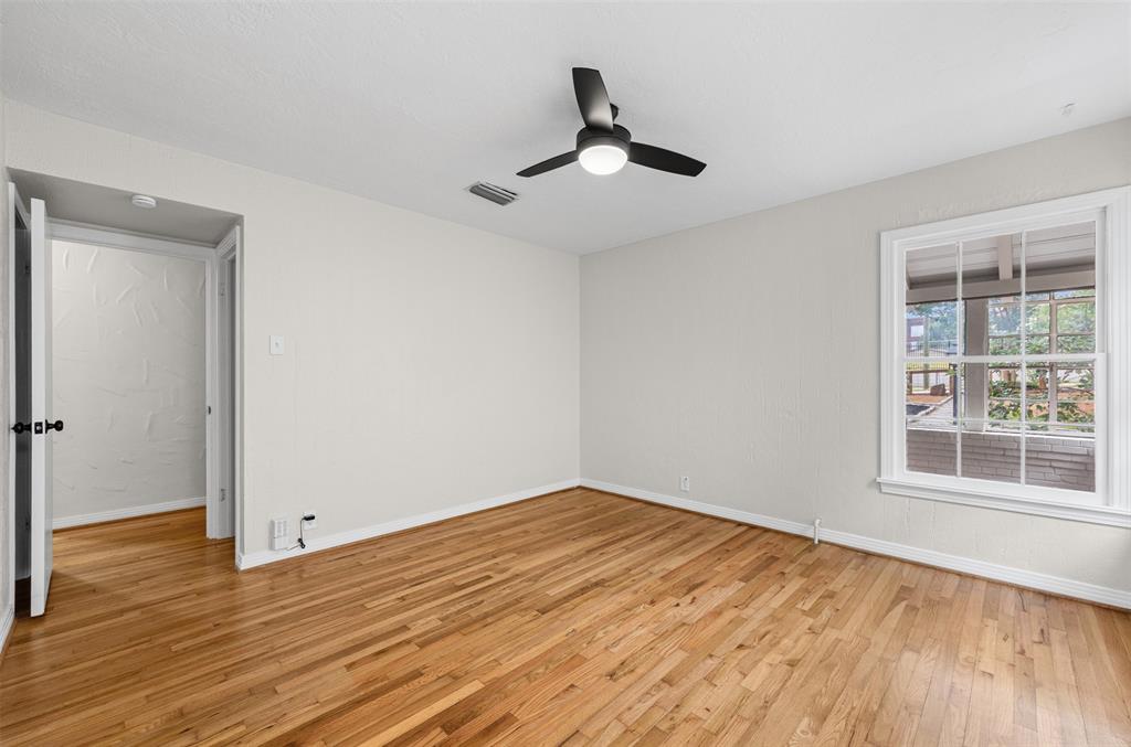 Bedroom with hardwoods and ceiling fan