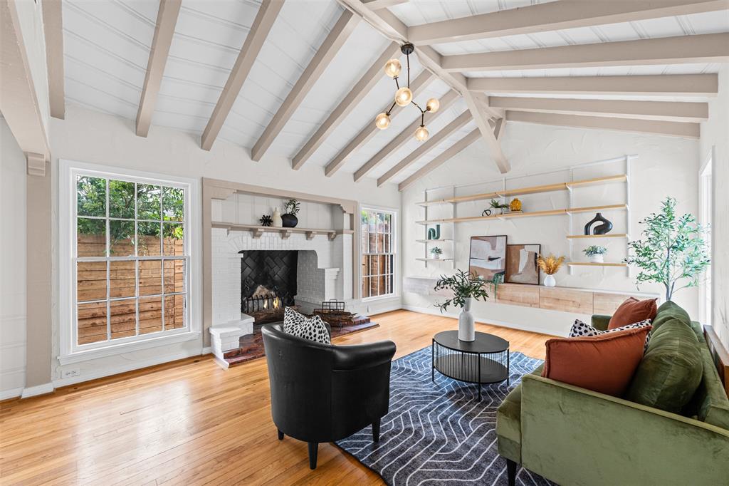 Living room with custom arched wood burning fireplace