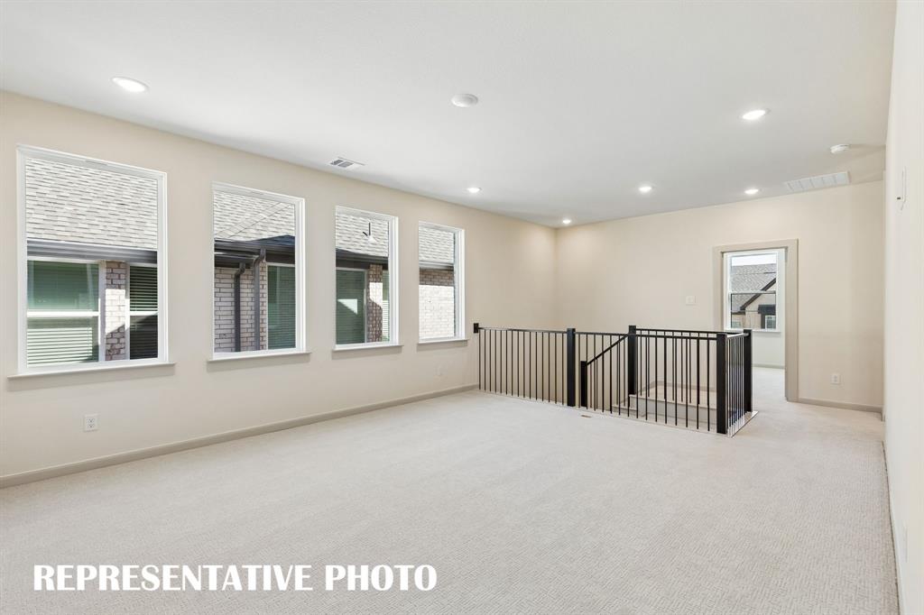 Endless hours of family fun to be enjoyed in this light and bright game room!  REPRESENTATIVE PHOTO
