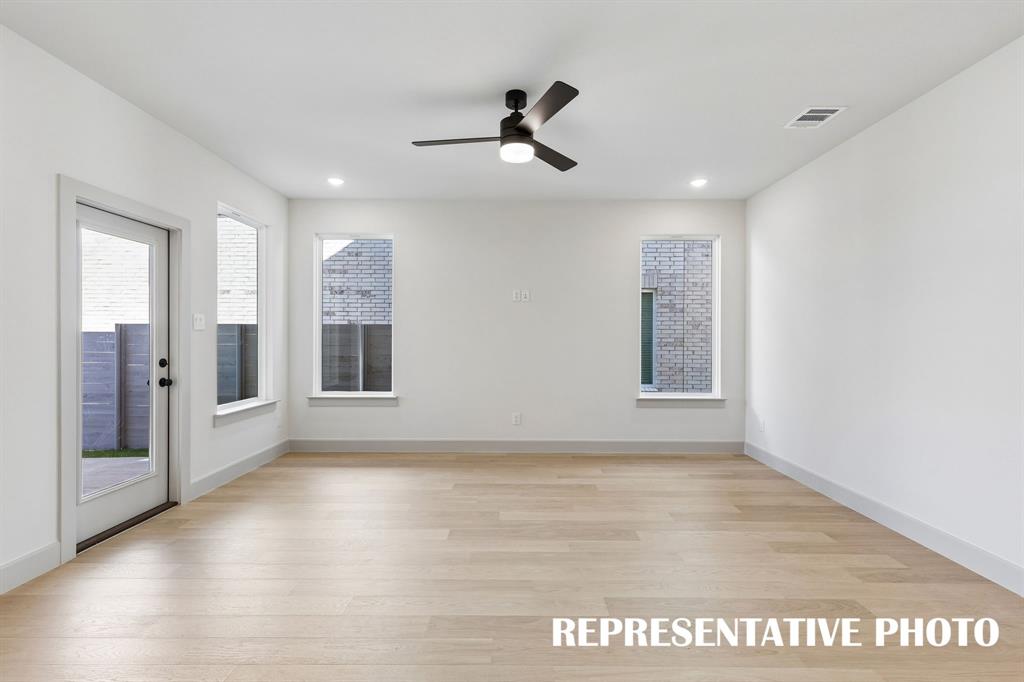 This spacious light filled family room offers a delightful space to entertain family and friends.  REPRESENTATIVE PHOTO