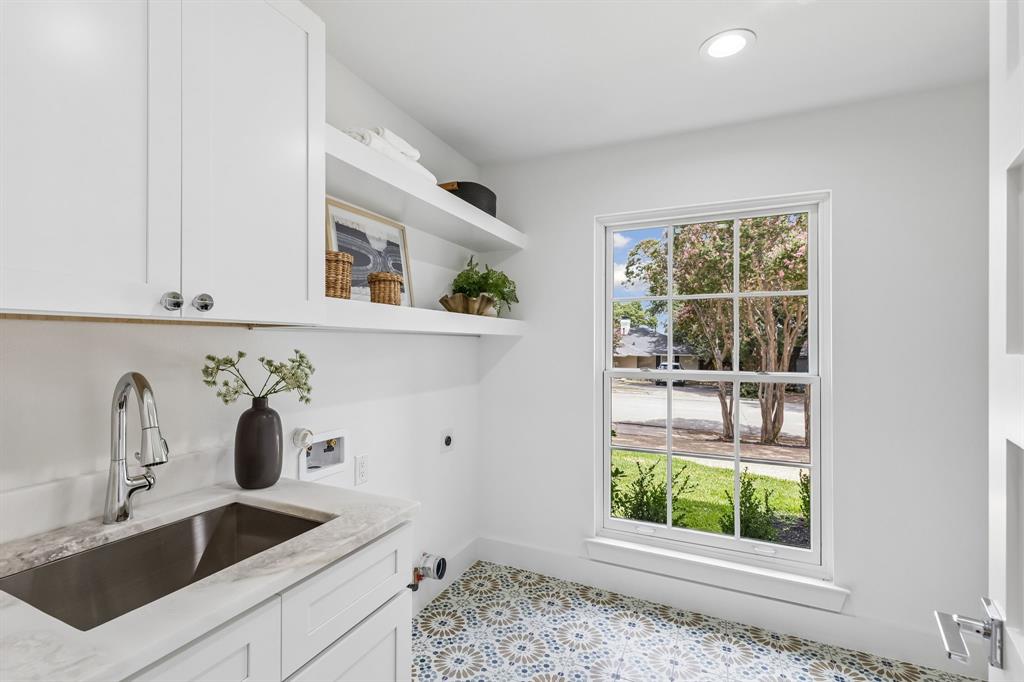 Convenient Laundry and oversized pantry area with sink