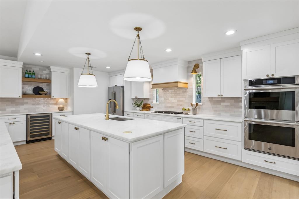 Two ovens,two islands,two beverage refrigerators