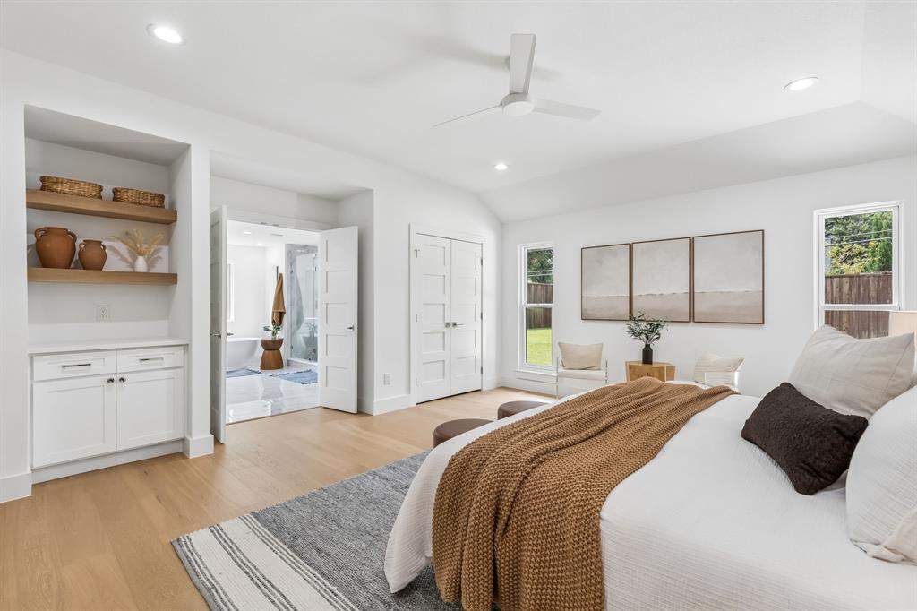 Primary bedroom offers space for coffee bar,2 closets,& en suite spa like bath