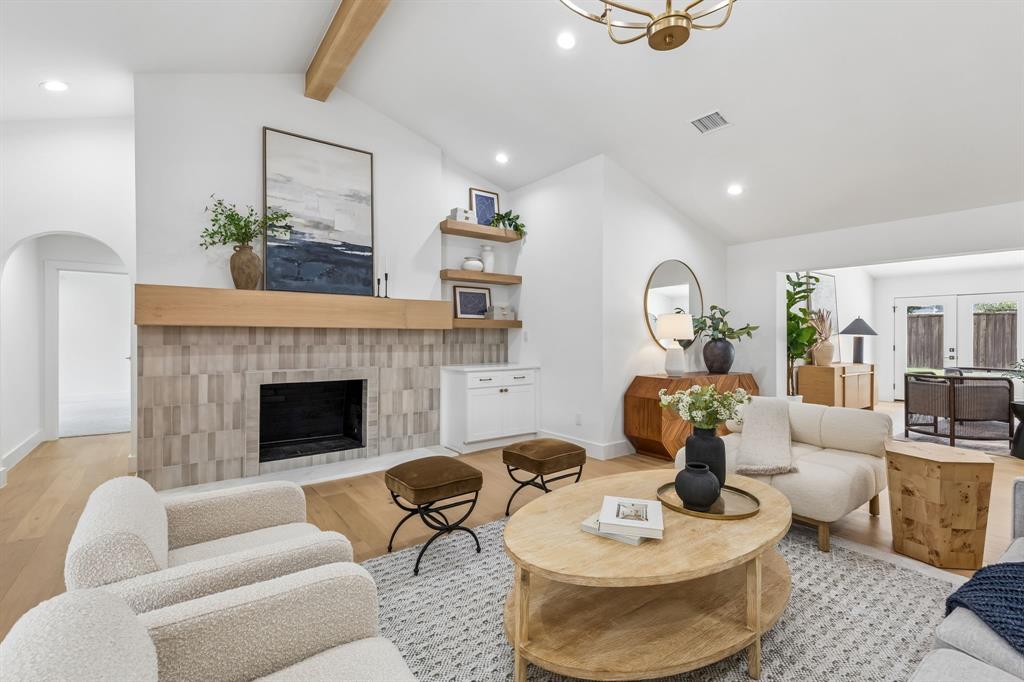 Designer touches in the great room include the beamed ceiling,current light fixture,tile selection,and built ins.