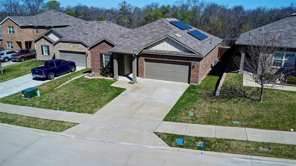 Brick exterior with a gabled roof and attached garage