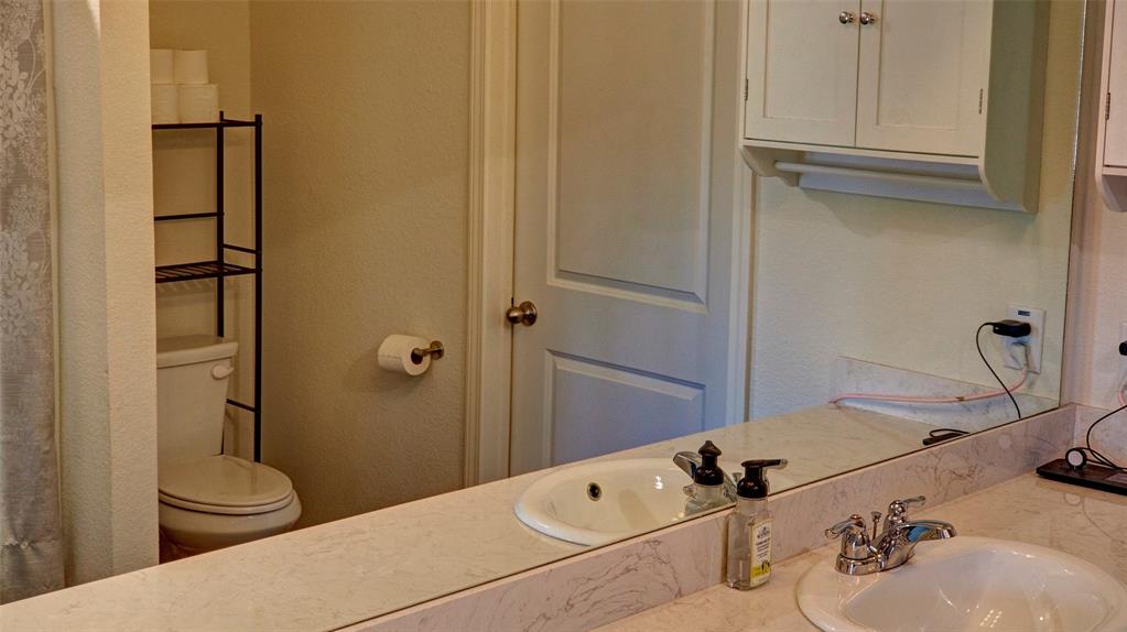 Dual vanity with integrated sinks and chrome fixtures