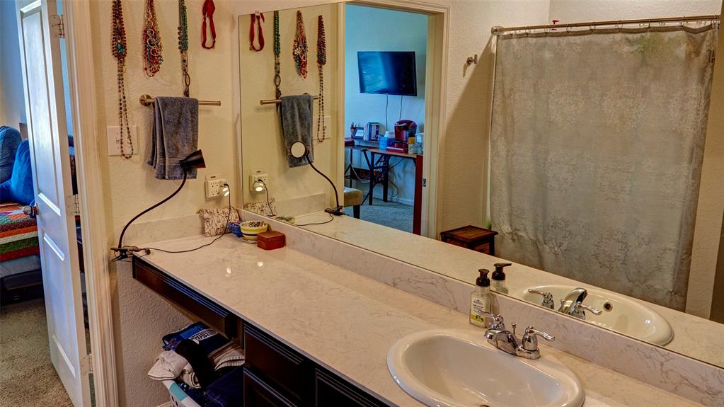 Extended vanity with an integrated sink and chrome faucet