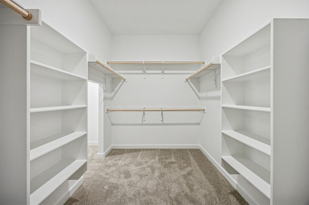Primary Closet in the Wimbledon home plan by Trophy Signature Homes – REPRESENTATIVE PHOTO