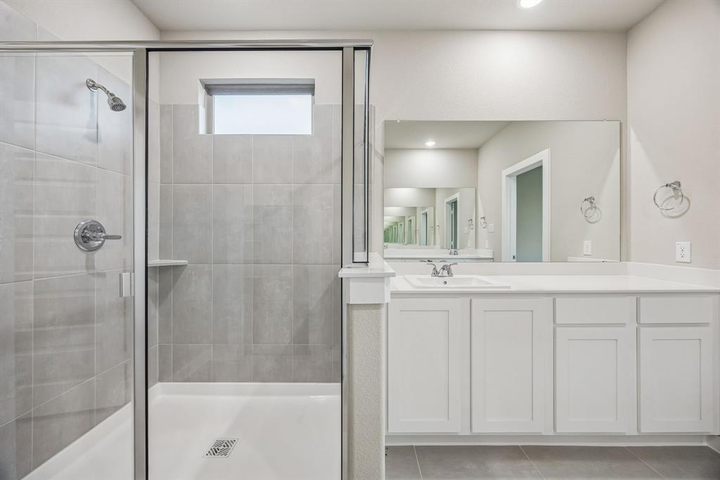 Primary Bathroom in the Wimbledon home plan by Trophy Signature Homes – REPRESENTATIVE PHOTO