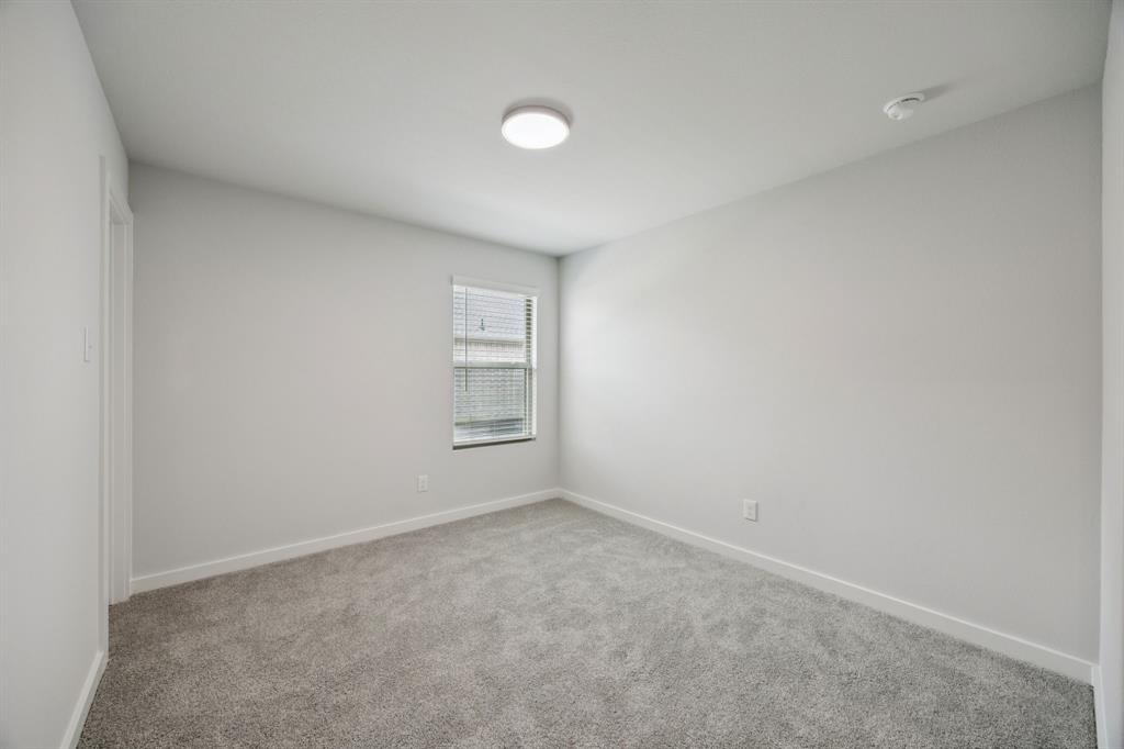 Bedroom in the Hadley home plan by Trophy Signature Homes – REPRESENTATIVE PHOTO