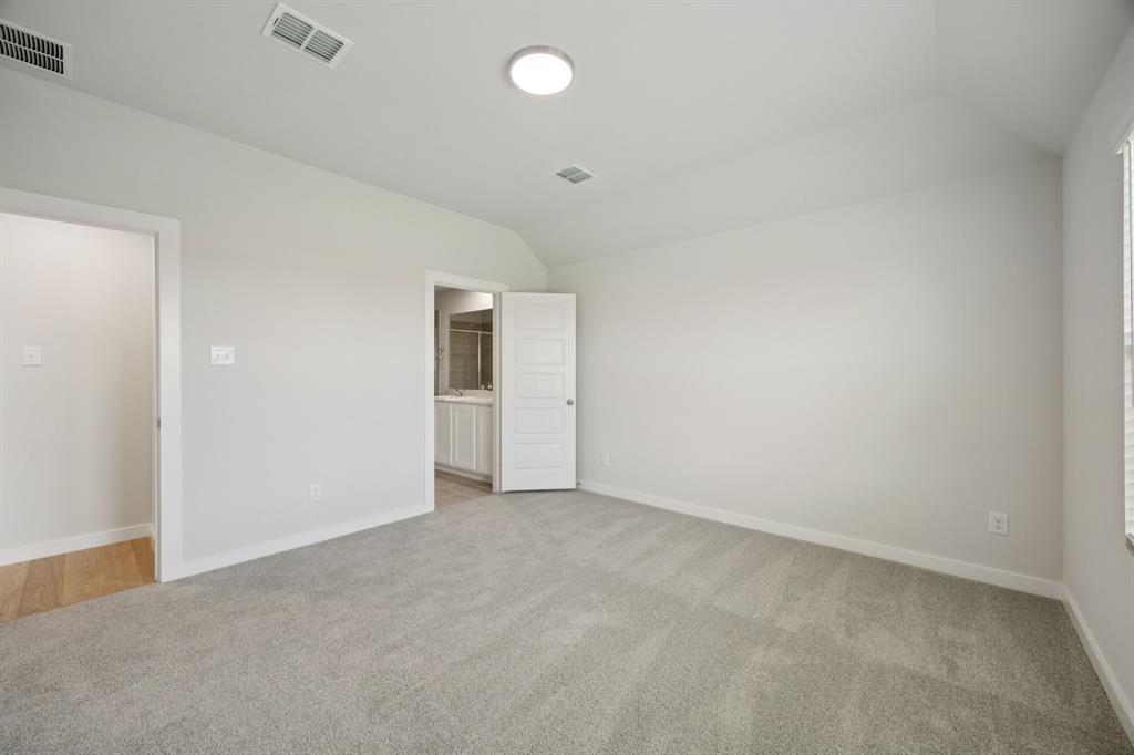 Primary Suite in the Hadley home plan by Trophy Signature Homes – REPRESENTATIVE PHOTO