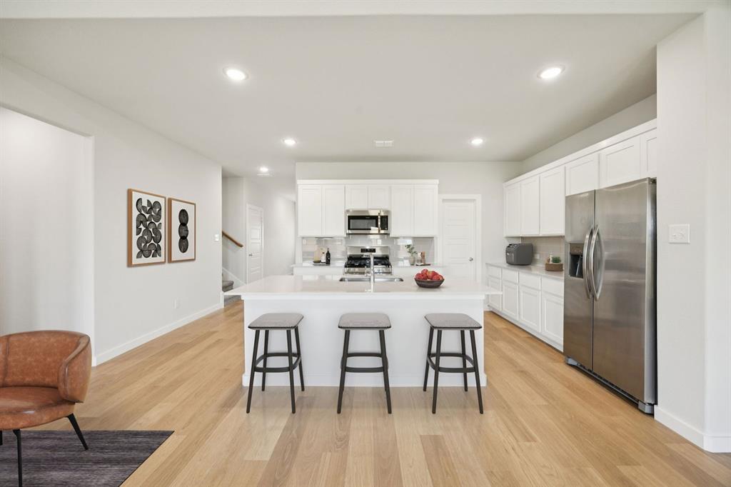 Kitchen in the Masters home plan by Trophy Signature Homes – REPRESENTATIVE PHOTO
