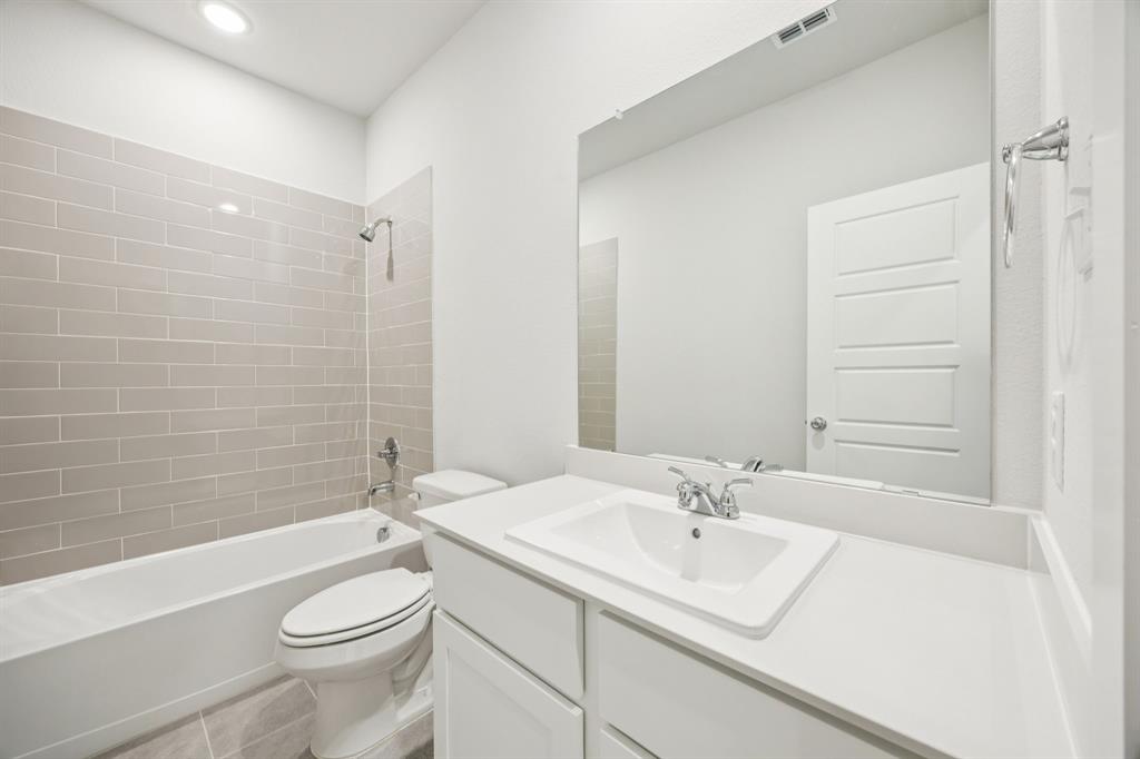 Bathroom in the Masters home plan by Trophy Signature Homes – REPRESENTATIVE PHOTO
