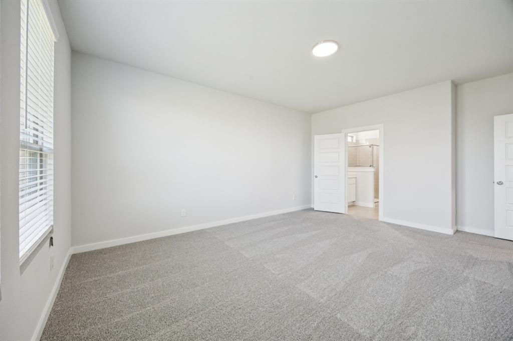Primary Suite in the Masters home plan by Trophy Signature Homes – REPRESENTATIVE PHOTO
