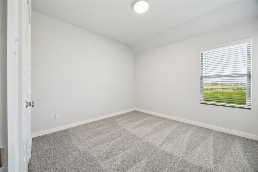 Bedroom in the Masters home plan by Trophy Signature Homes – REPRESENTATIVE PHOTO