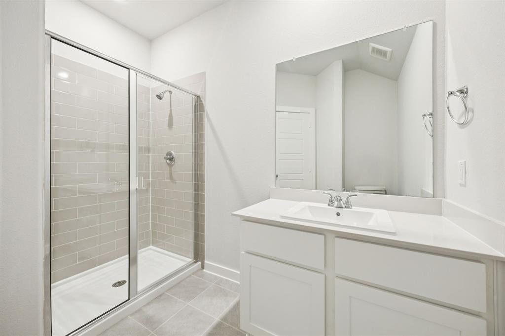 Bathroom in the Masters home plan by Trophy Signature Homes – REPRESENTATIVE PHOTO