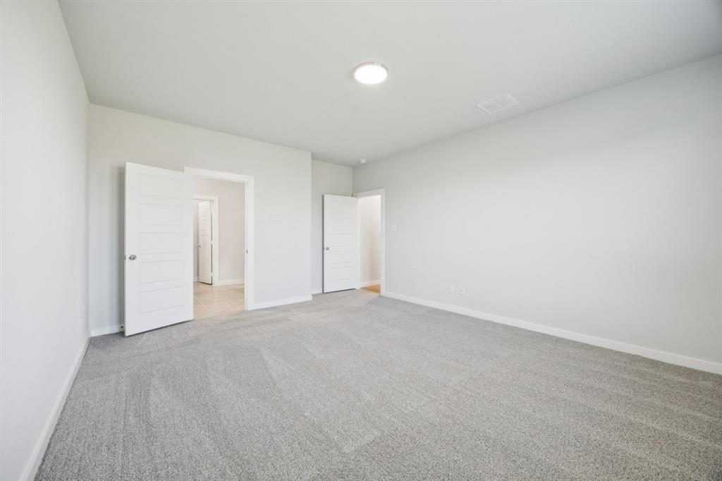 Primary Suite in the Masters home plan by Trophy Signature Homes – REPRESENTATIVE PHOTO