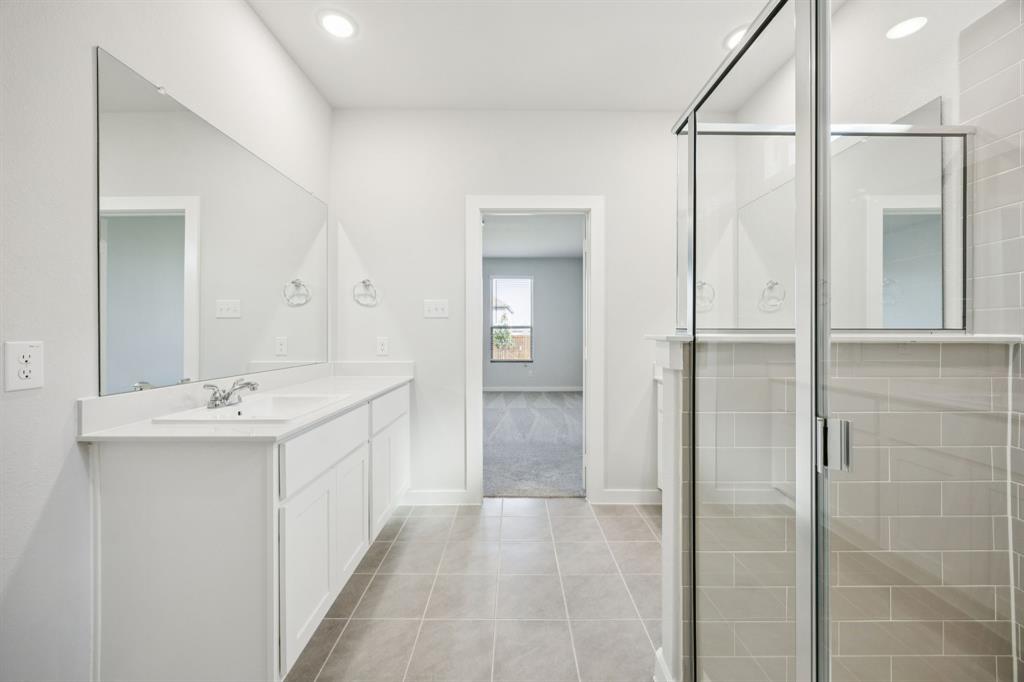 Primary Bathroom in the Masters home plan by Trophy Signature Homes – REPRESENTATIVE PHOTO