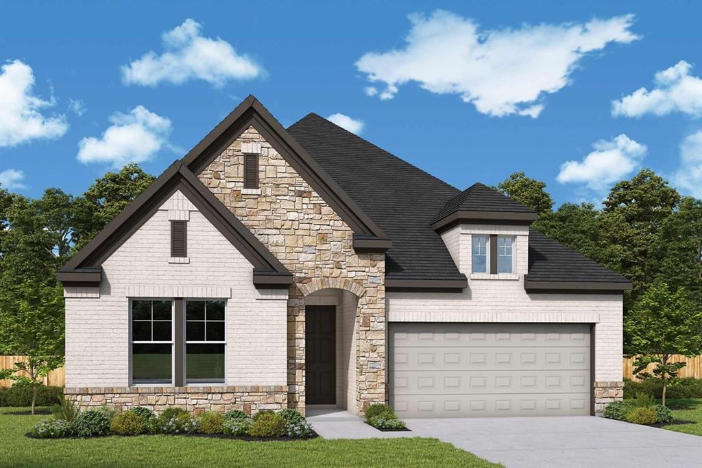 Exterior featuring a mixed material facade of stone and light-toned brick, dark shingle roof, arched entry, two-car garage, and established landscaping Exterior featuring a mixed material facade of stone and light-toned brick, dark shingle roof, arched entry, two-car garage, and established landscaping