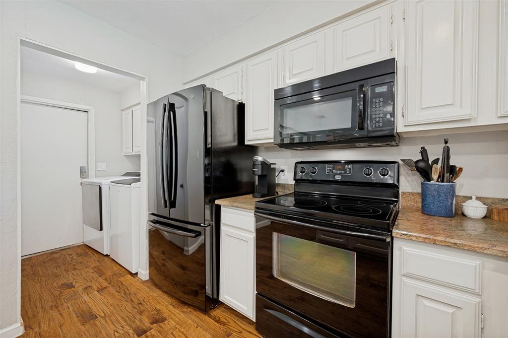 Utility Room accommodates full sized washer/dryer and  is conveniently located between the Kitchen and door to Garage