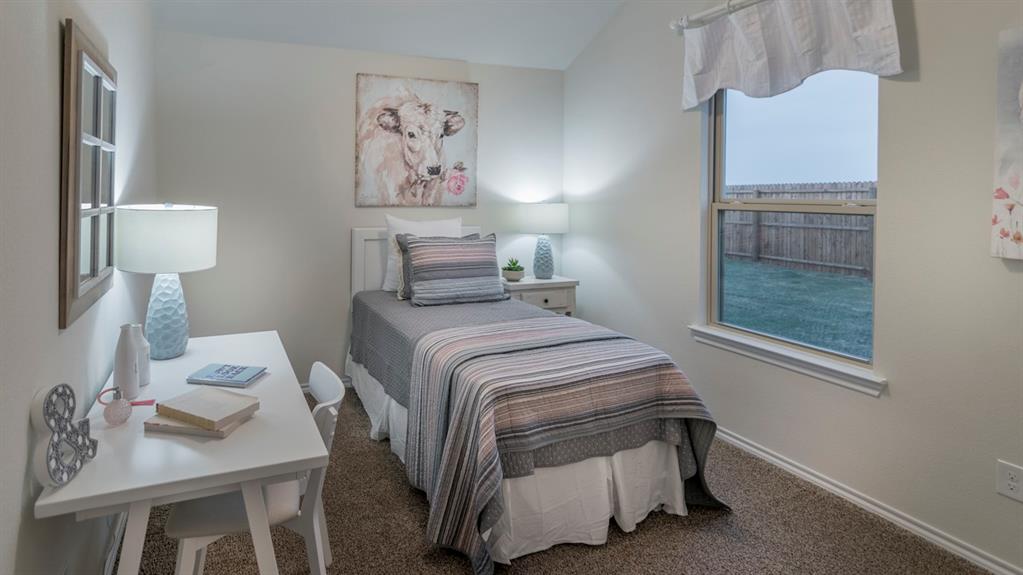 Carpeted bedroom featuring a built-in window and light-toned walls