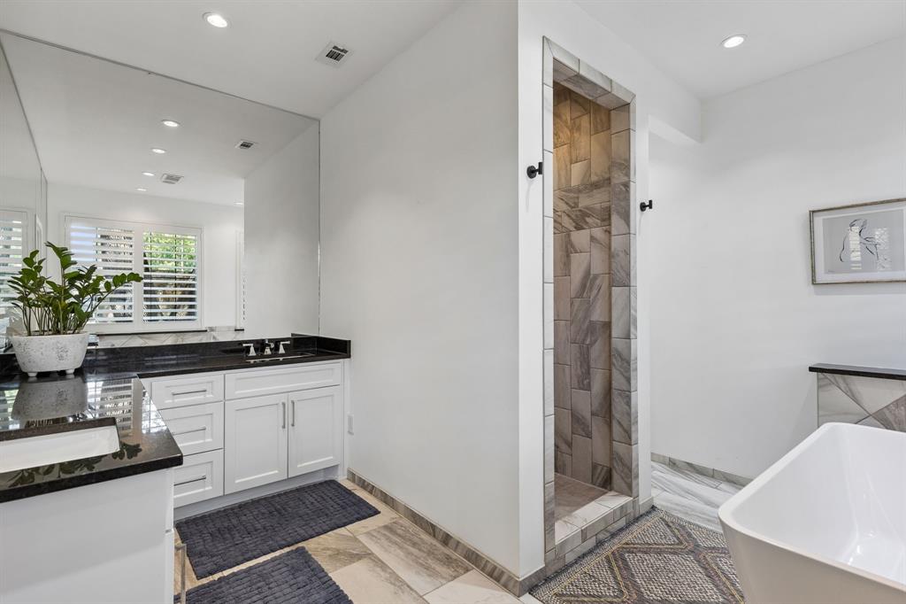 The primary bath is serene and spa like with free-standing tub, walk-in shower and great natural light.