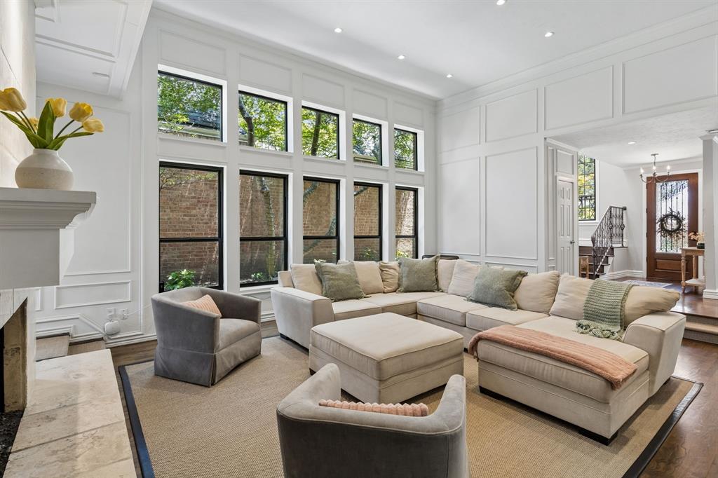 Our favorite part of this home is the sunken family room and wall of windows.
