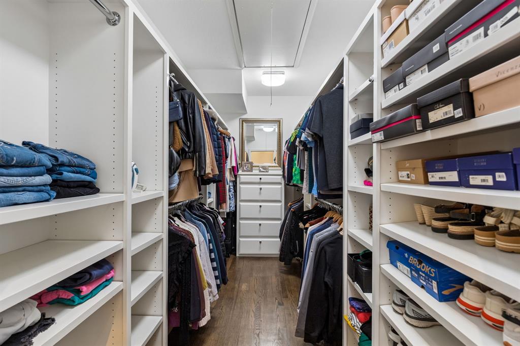 The primary closet is unusually big for this neighborhood. Built-in shelving and drawers help with space optimization.