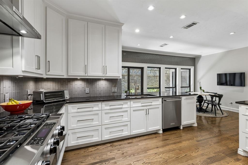 Functional, stylish, and spacious kitchen with extended cabinetry, soft close drawers, and great prep space.