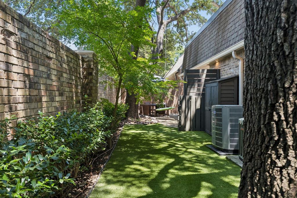 In addition to the oak trees, there are beautiful shrub hedges and japanese maple trees.