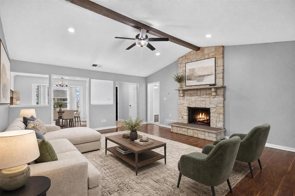 Spacious living room with high ceilings and stone fireplace. Spacious living room with high ceilings and stone fireplace.