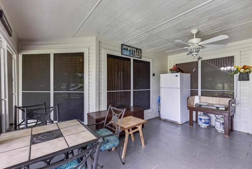 Screened patio with tile flooring