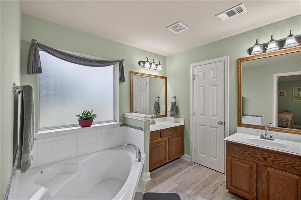 double sinks, garden tub, separate shower and walk in closet