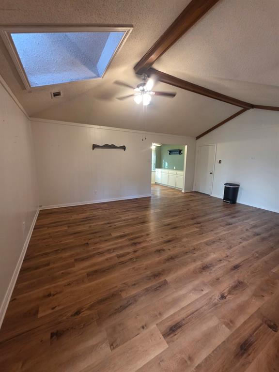 Den with skylight looking toward built ins in breakfast Den with skylight looking toward built ins in breakfast