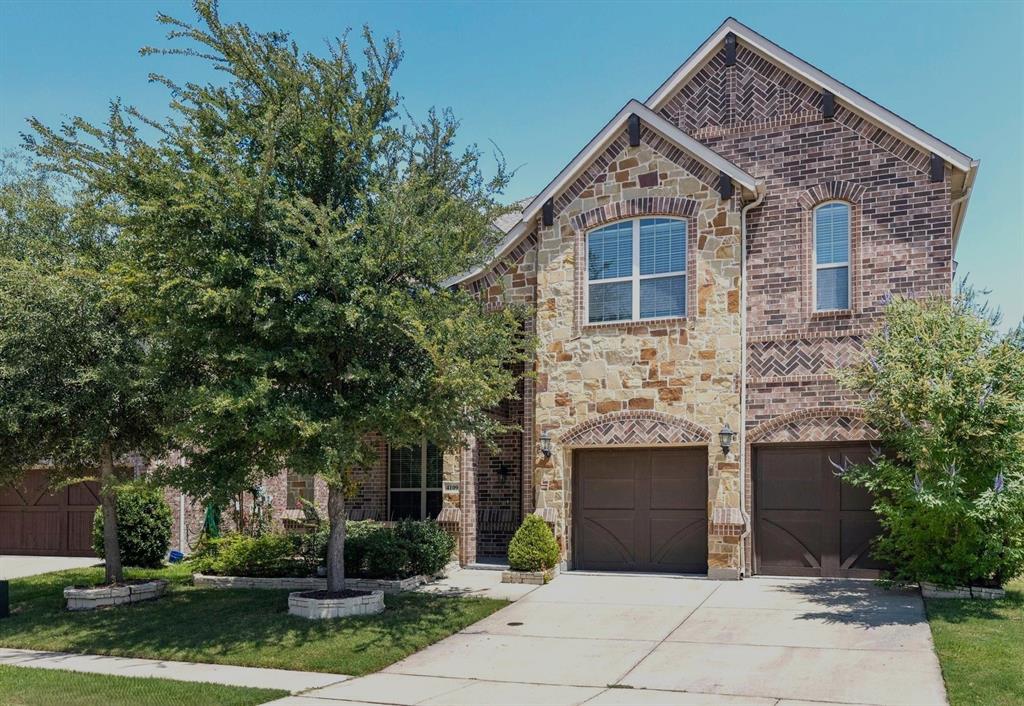 Stone and brick facade with arched accents Stone and brick facade with arched accents