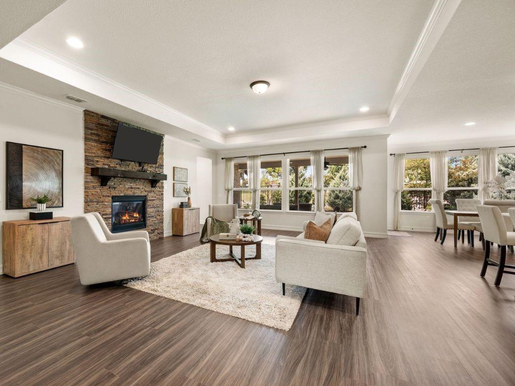Tray ceiling and stacked stone fireplace in Gathering Room
