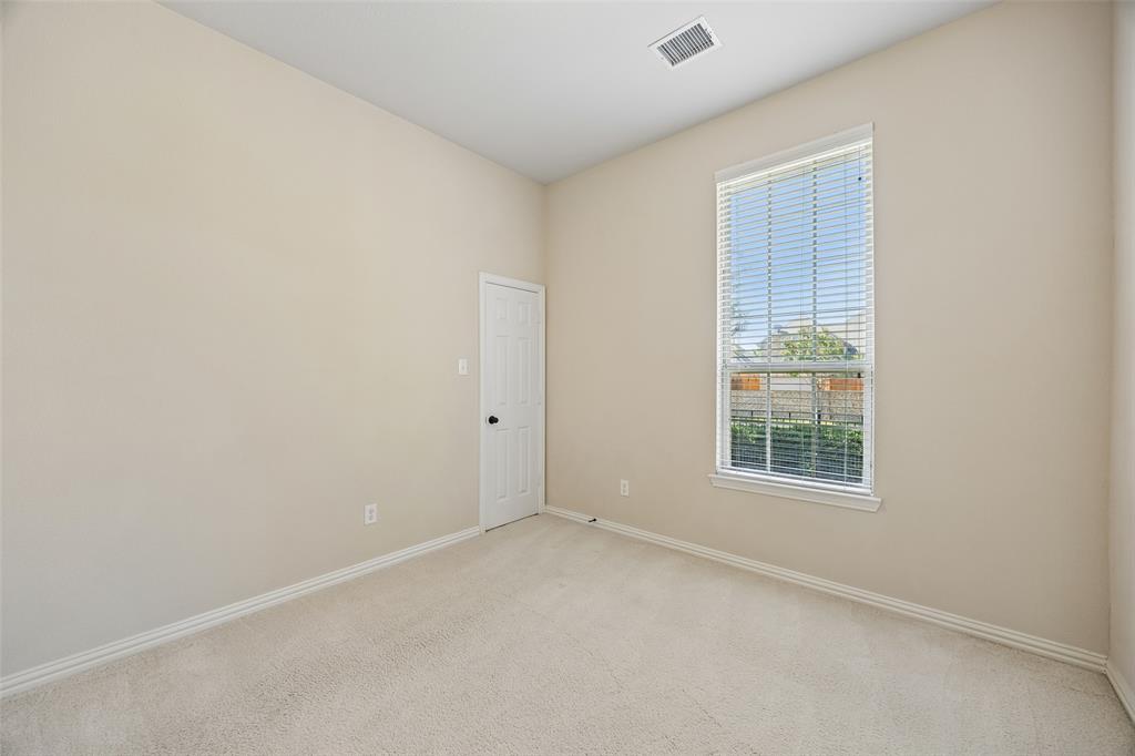 Secondary bedroom with large walk in closet