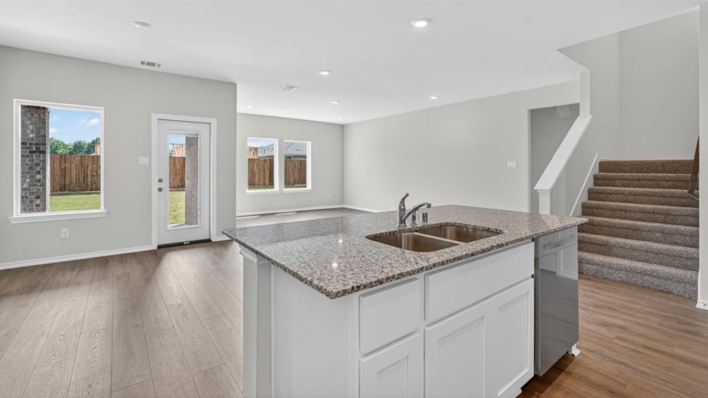 Kitchen island with dual basin sink and granite countertop
