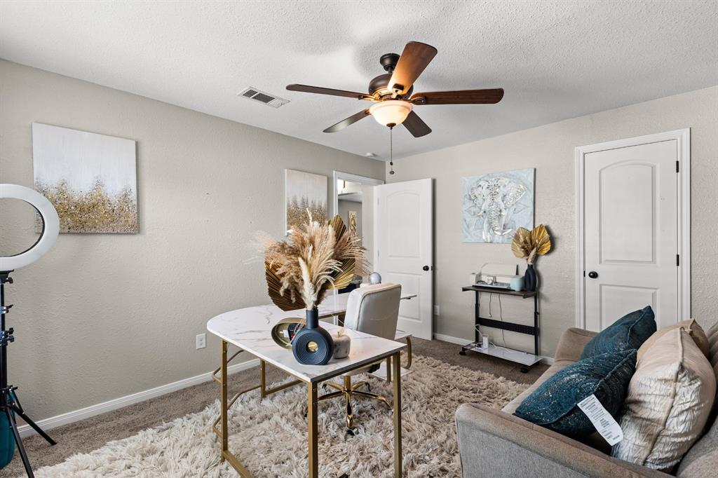 Room featuring neutral wall paint, a ceiling fan with integrated lighting, and carpet flooring