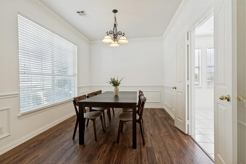 Formal dining room with new LVP flooring and custom wainscoting