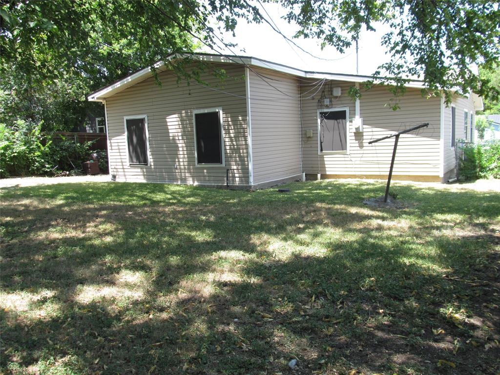 REAR RIGHT TO UPPER LEFT OF YARD VIEW OF BACK YARD CROSS VIEW