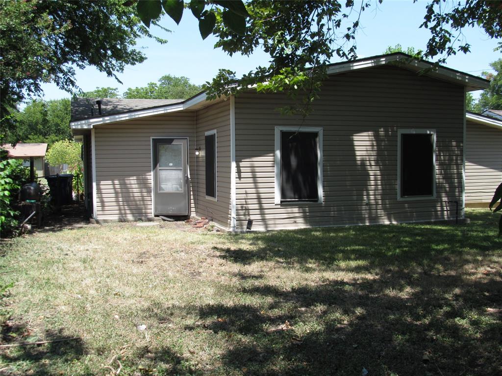 REAR LEFT VIEW  OF BACK DOOR AND REAR OF HOME ANGLE #2