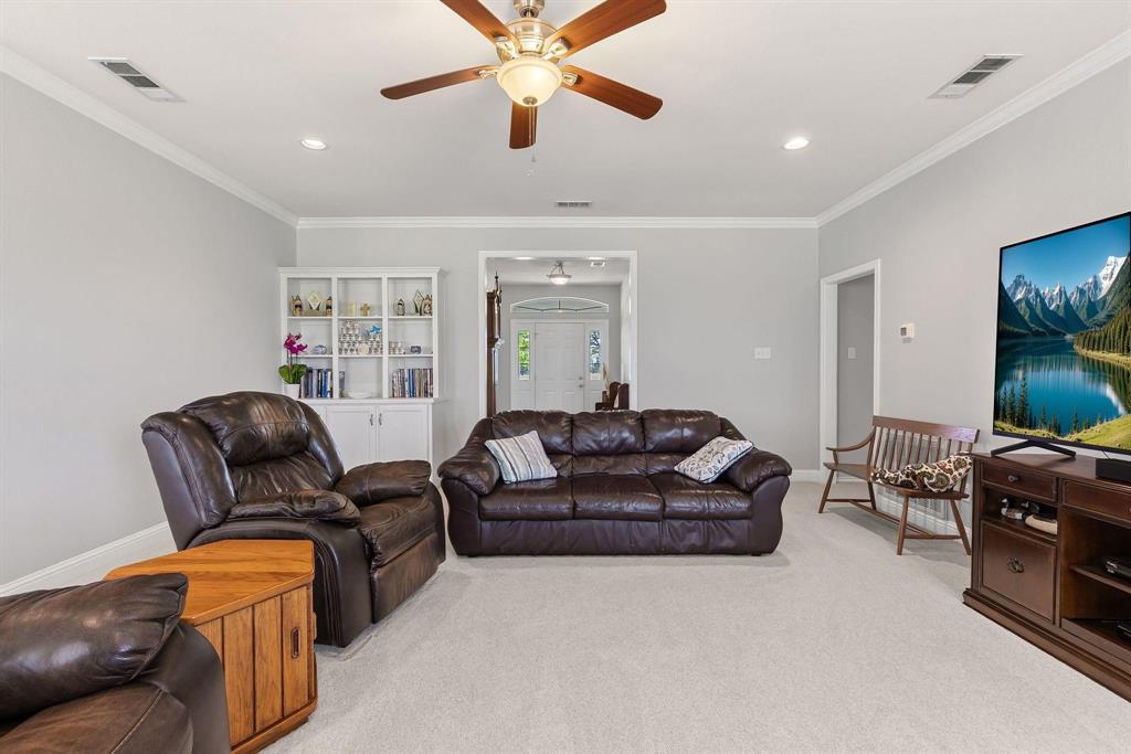 Living area featuring plush carpeting and neutral wall tones